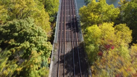 Following the Train Track Low to High (cool fall shot) Stock Footage 314202068