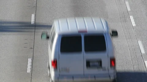 Following van up freeway to sign Stock-Footage 29612649
