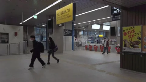 Following view while walking in subway train station in rush hour with many.. Stock Footage 228857382