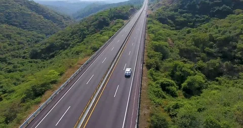 Following white car through the mountains Stock Footage 101655893