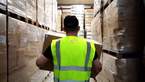 Following Worker Walking Through Warehouse Stock Footage 156499326