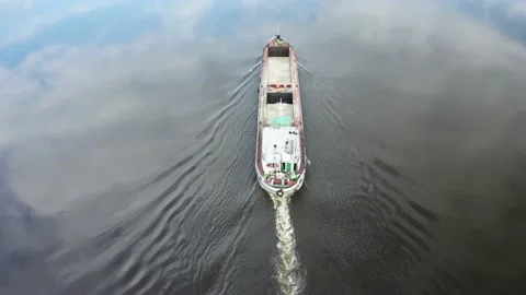 Folowing empty cargo ship barge Stockbeeldmateriaal 154501489