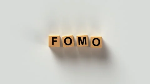 FOMO Fear of Missing Out Acronym on Wooden Letter Blocks 3D render animation Stock Footage 338313734