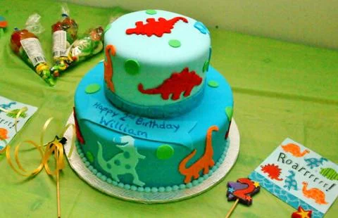 Fondant cake with dinosaurs Stock Photos