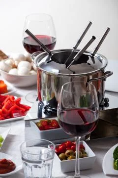 Fondue set on a table Stock Photos