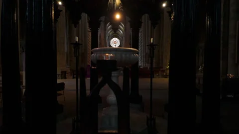 Font and candles in the interior of Durham Cathedral Stock Footage 282776836