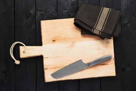 Food background concept. Chopping board with dishtowel and stainless steel ve Stock Photos