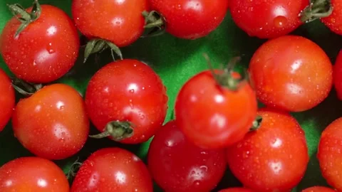 Food background. One tomato falling to the others. Healthy eating concept. Stock Footage 309098053
