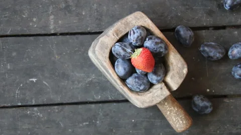 Food background, plums and strawberry Stock Footage