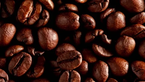 Food background of rotating roasted coffee beans close-up. Flat lay. Stock Footage 171859808