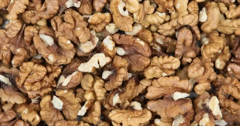 Food background. Walnut kernels rotating Stock Footage 107835112