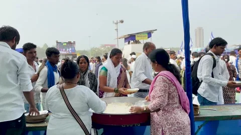 Food being distributed to underprivileged section of society (Social Service). Stock Footage 258336182