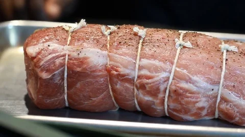 Food Chef preparing cooked pork roast. A delicious piece of meat Stock Footage 76200028