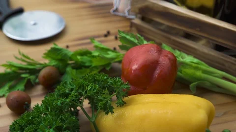 Food composition resh vegetables and hot pizza on wooden table. Traditonal Stock Footage 104398162