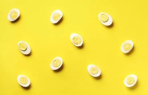Food concept with boiled eggs pattern on yellow background. Top view. Creative 스톡 사진