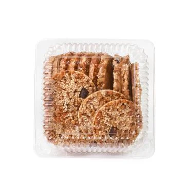 Food concept. In a container stack of cookies with sesame seeds isolated on a Foto stock