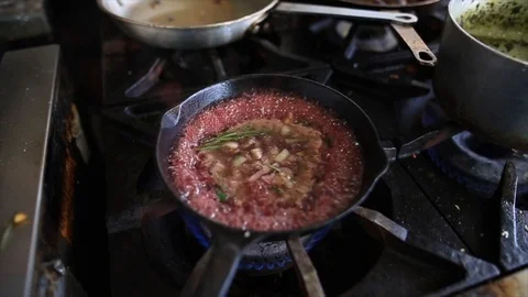Food cooking on a gas flame Stock Footage