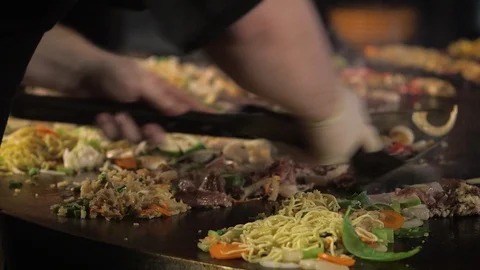 Food Cooking on Mongolian Style Restaurant Grill Stock Footage