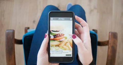 Food delivery app on tablet device urban convenience Stock Footage 90338910