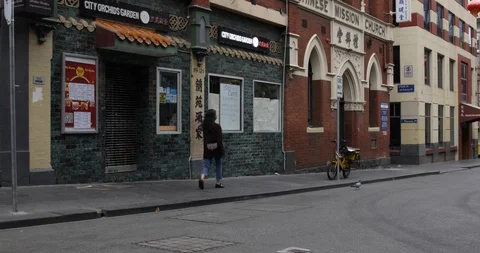 Food Delivery Driver Rides Down Deserted Road in Chinatown COVID 19 Video stock 128939592