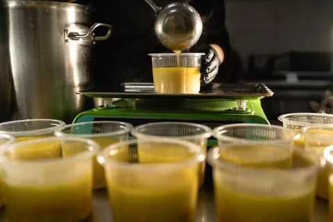 Food delivery in the restaurant. The chef prepares and prepares food in dispo Stock Photos