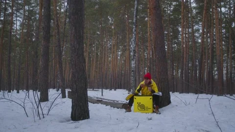 A food deliveryman eats in the forest Stock Footage 236897487