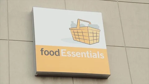 Food essentials writing caption text square sign mounted to wall with picture Stock Footage 249756341