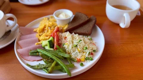 Food in the form of rice, vegetables, ham, vegetables close-up Stock Footage 295664591