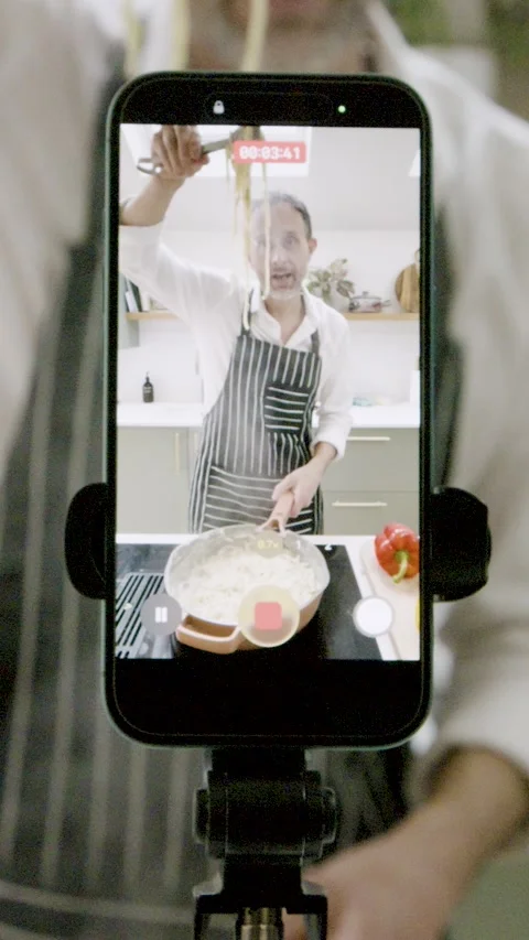 Food Influencer Filming Cooking Tutorial on Smartphone. Vertical Shot Stock Footage 328761239