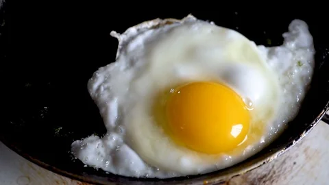 Food; kitchen; breakfast; hot; egg; cooking; break;close up, slow motion Stock Footage 101024501