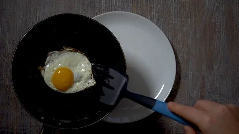 Food; kitchen; breakfast; hot; egg; cooking; break;close up, slow motion Stock Footage 101024700