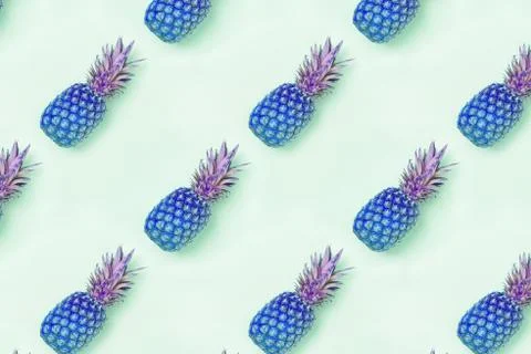 Food pattern with pineapples colored in blue color. Stock Photos