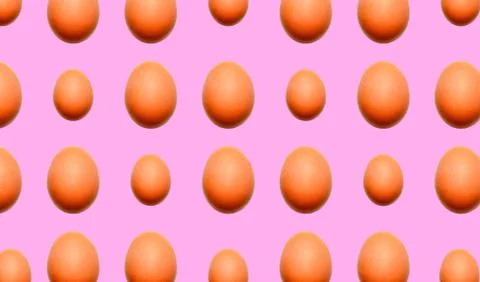 Food pattern of whole eggs of different sizes on a pink background. Stock Illustration