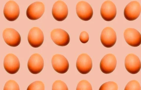 Food pattern of whole eggs with shadow on a beige background. Stock Illustration