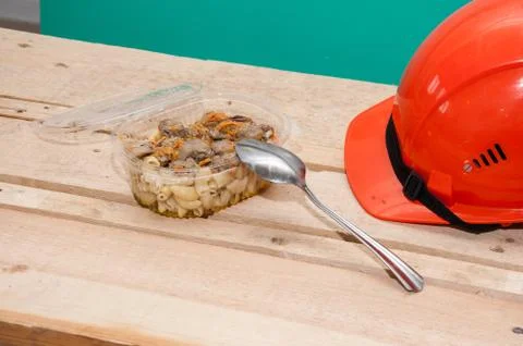 Food in a plastic container. Construction worker's lunch break Stock Photos