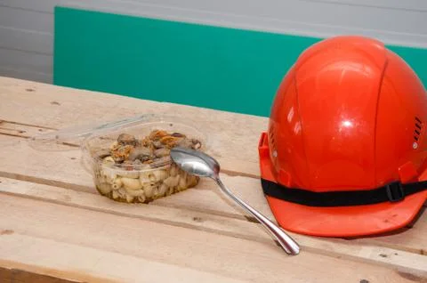 Food in a plastic container. Construction worker's lunch break Stock Photos