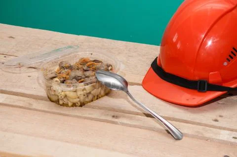Food in a plastic container. Construction worker's lunch break Stock Photos