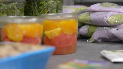 Food in plastic containers prepped for sorting Stock Footage 100824046