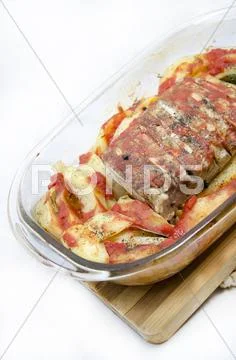 Food - Pork steak with baked potatoes and spices Stock Photos