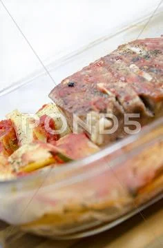 Food - Pork steak with baked potatoes and spices Stock Photos