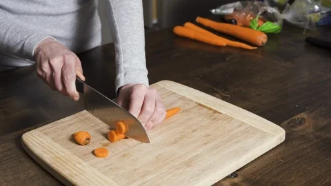 Food prep time-lapse cutting carrots Stock Footage 121443648