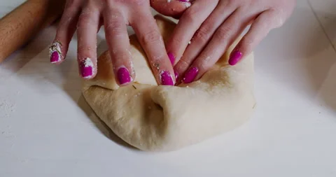 Food preparation, cruc dough and cheese, in the kitchen at home. Slow motion. Stock Footage 148667553
