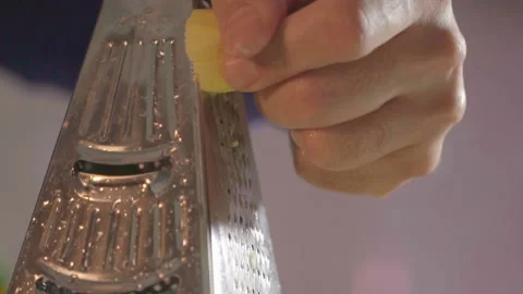Food preparation, grating ginger Stock-Footage 141095732