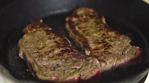 Food preparation sequence showcasing cooking technique and texture detail Stock Footage 333718845