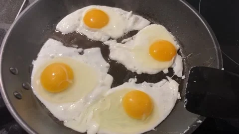 Food - Preparing fried eggs Video stock 149494438