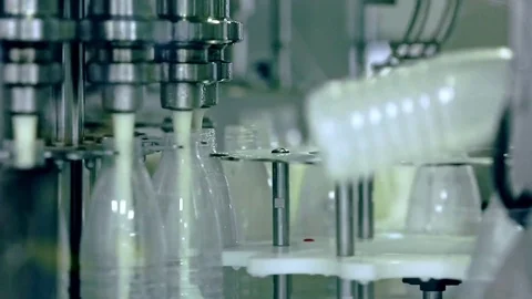Food-processing-factory-milk-injection-into-bottle Stock Footage 126230871