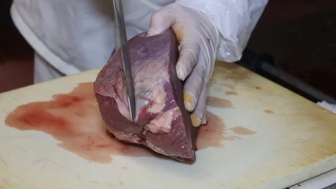 Food processing plant, beef meat. Workers cut meat Stock Footage 85488002