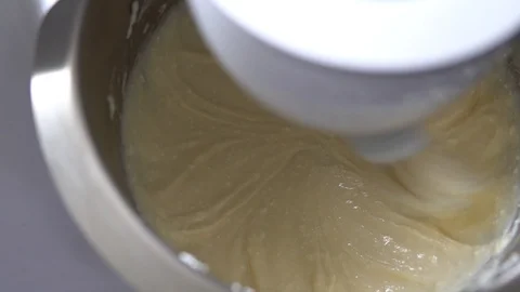 A food processor, a blender mixes cottage cheese with sugar and other Stock Footage 89004723