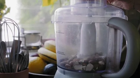 Food processor chopping up almond	 Stock Footage 75759533
