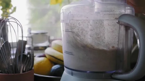 Food processor chopping almonds	 Stock Footage 75759483